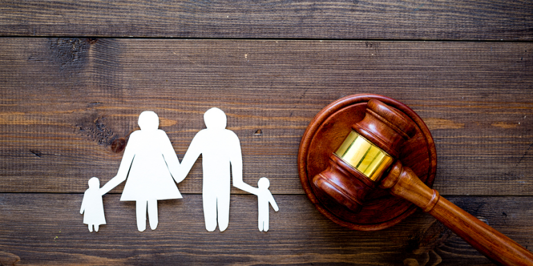 Family cutout and gavel depicting COVID-19 and Child Custody Arrangements in Michigan