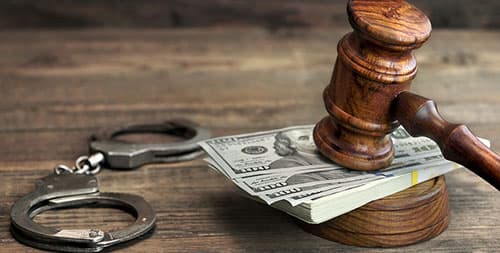 Handcuffs, money, and gavel