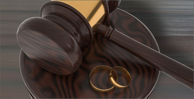 Gavel and wedding rings depicting  Domestic Violence Lies, Divorce Truths and What You Need To Know