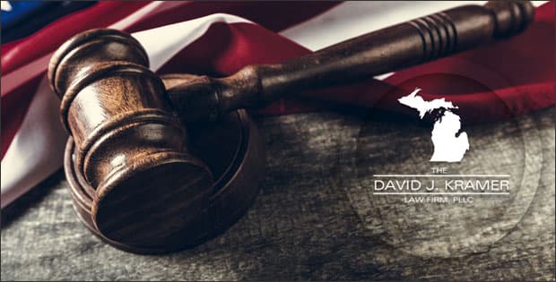 American flag, gavel, and federal sentencing attorney, David J. Kramer