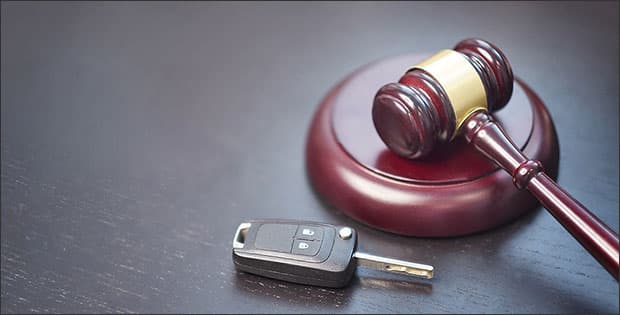 Gavel and car key depicting driver's license restoration help