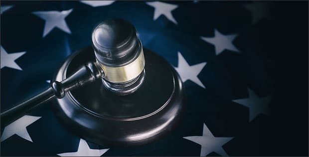 Gavel and flag depicting stealing political yard signs charges