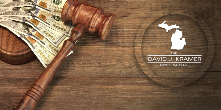 Law gavel and cash depicting high cost of public defender