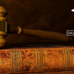 Gavel on book - Insurance fraud attorney David J. Kramer
