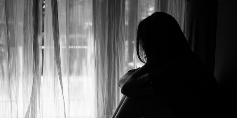 Silhouette of female depicting sex trafficking