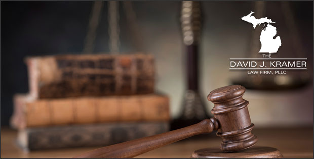 Law gavel, books, and Michigan vandalism criminal lawyer, David J. Kramer.
